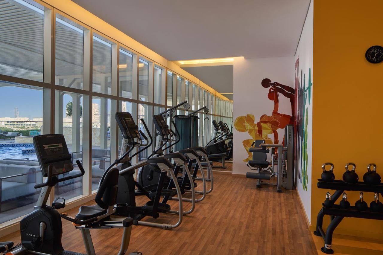 Movenpick Jumeirah Village Triangle Dubai Exterior foto The gym at the hotel