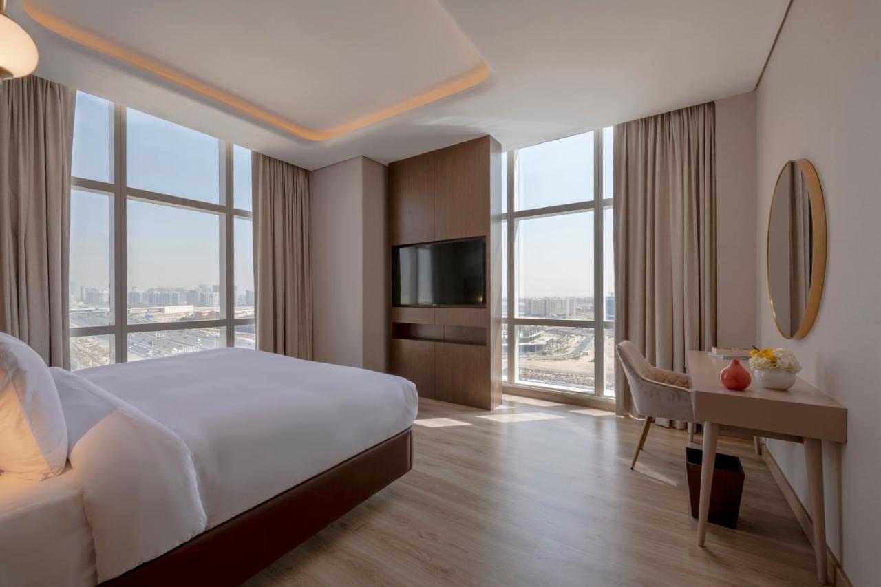 Movenpick Jumeirah Village Triangle Dubai Exterior foto A bedroom at the hotel