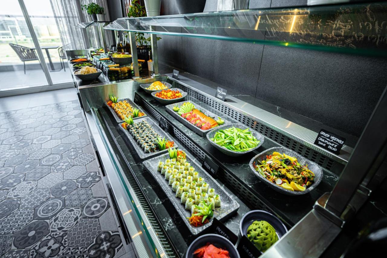 Movenpick Jumeirah Village Triangle Dubai Exterior foto A salad bar