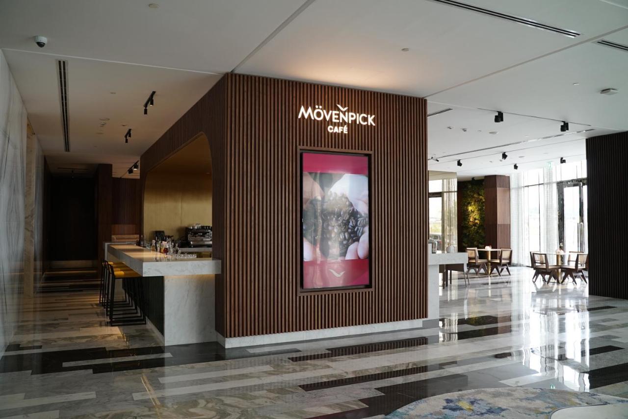 Movenpick Jumeirah Village Triangle Dubai Exterior foto Mövenpick Café in the lobby of the Kempinski Hotel, Amman, Jordan