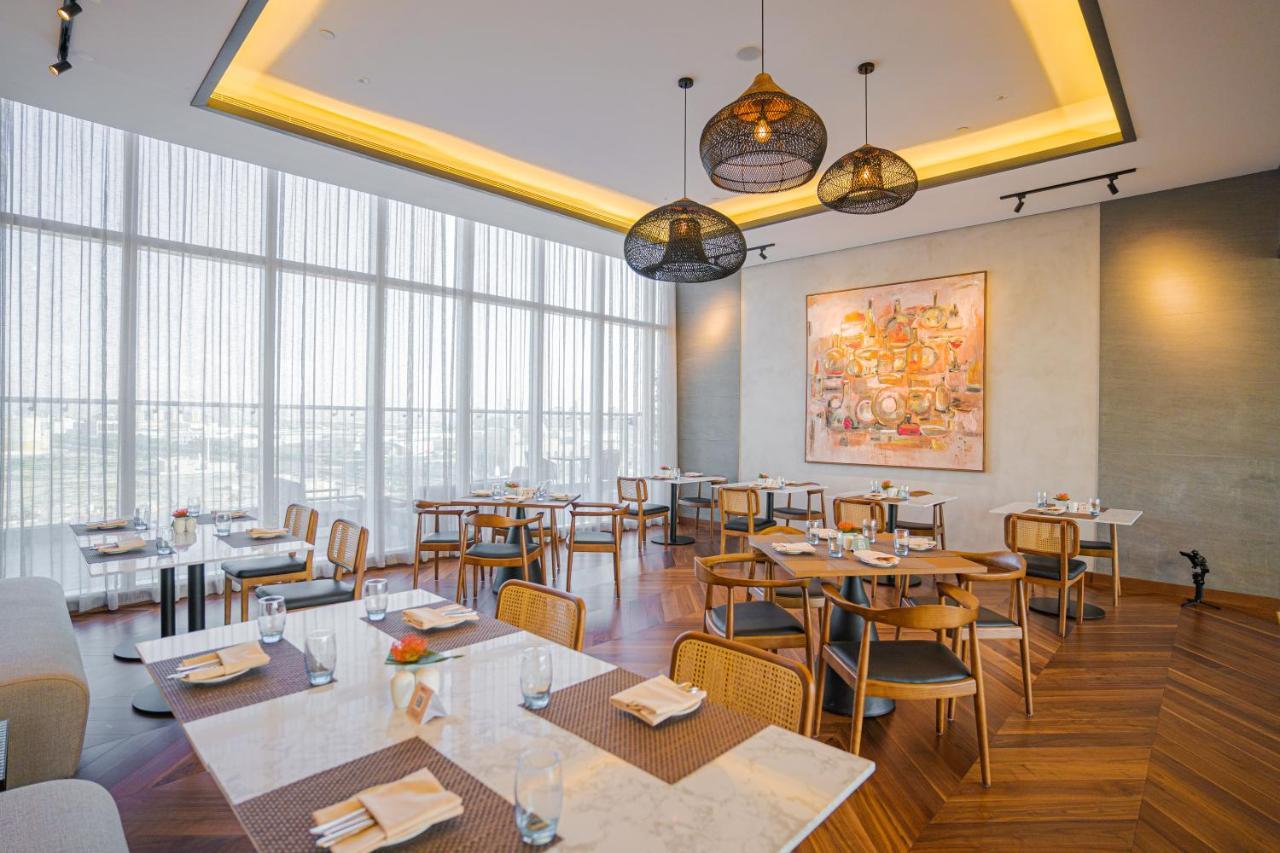 Movenpick Jumeirah Village Triangle Dubai Exterior foto The restaurant