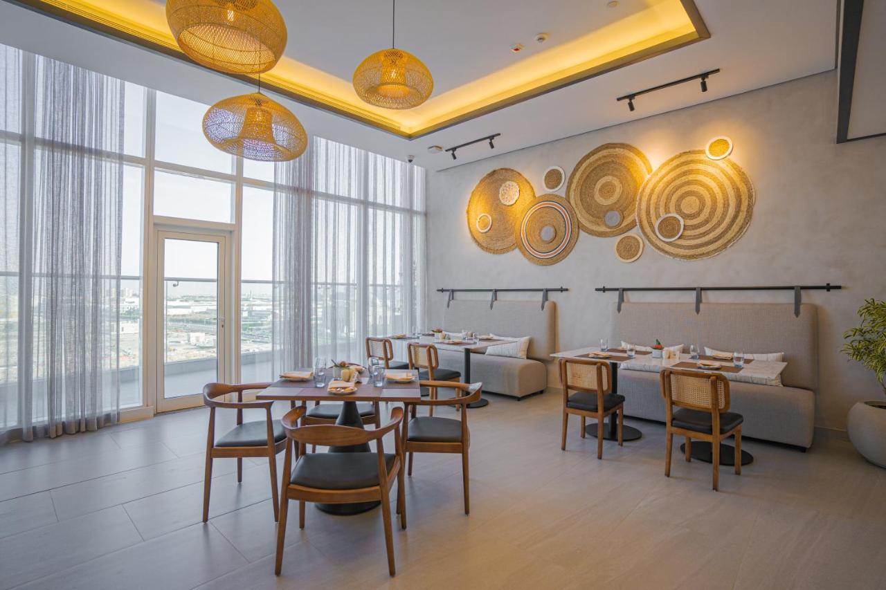 Movenpick Jumeirah Village Triangle Dubai Exterior foto The restaurant